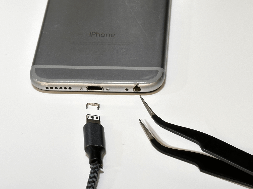 use pair of tweezers to fix iphone charging port 